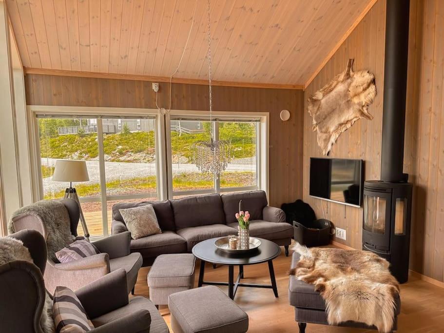 a living room with a couch and a table at Harevadet 211 in Hornindal