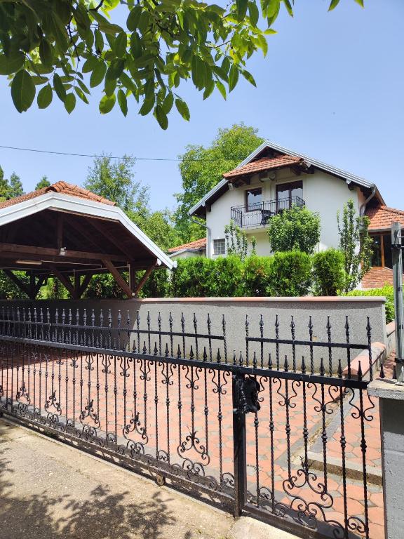 a fence in front of a house at Vikendica Majevicka Oaza in Tuzla