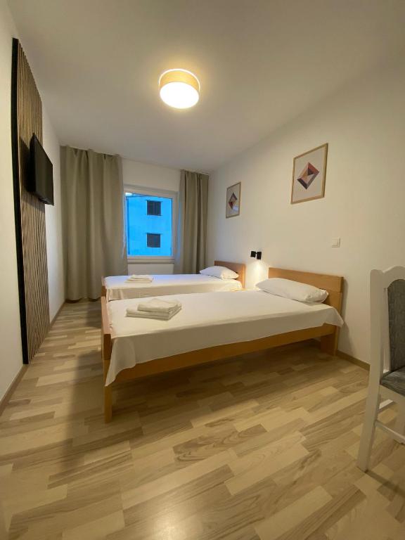 Posteľ alebo postele v izbe v ubytovaní Apart-pansion Promajna