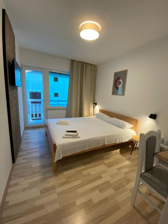 Posteľ alebo postele v izbe v ubytovaní Apart-pansion Promajna