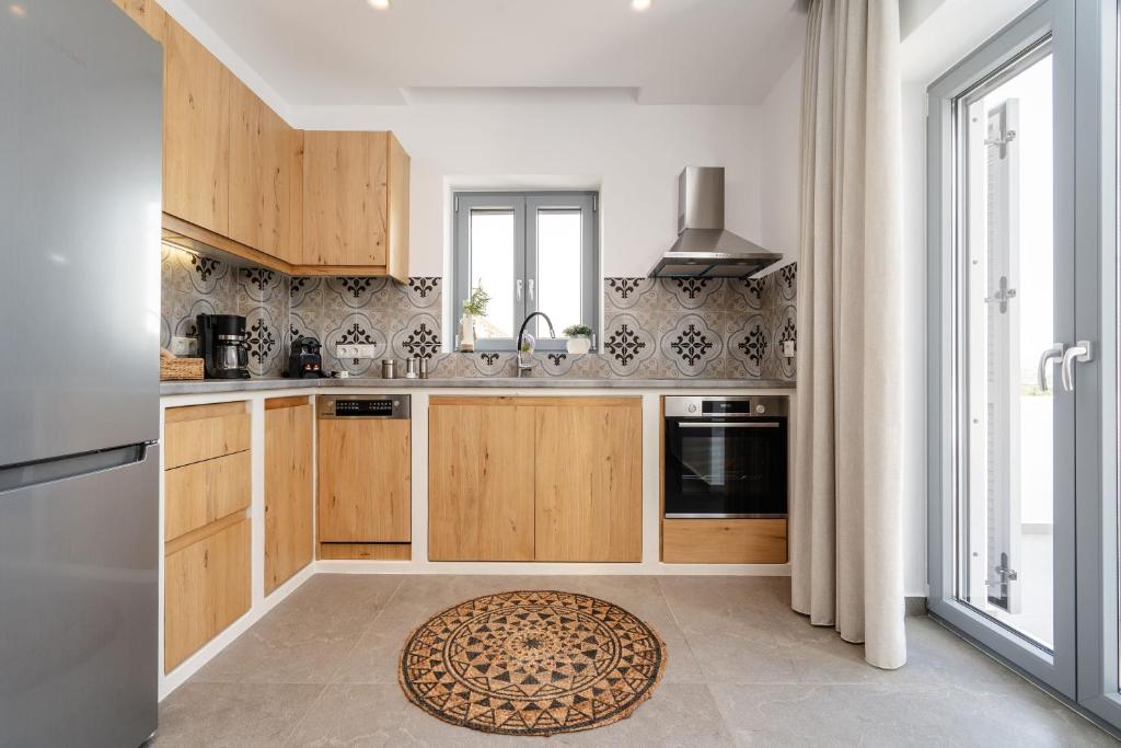 Kuchyň nebo kuchyňský kout v ubytování Nymphée Luxury Villas