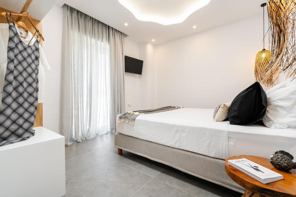 Postel nebo postele na pokoji v ubytování Nymphée Luxury Villas