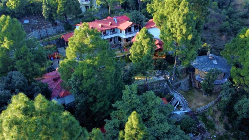 an overhead view of a large house with a red roof at The Nature's Green Resort, Bhimtal, Nainital in Nainital