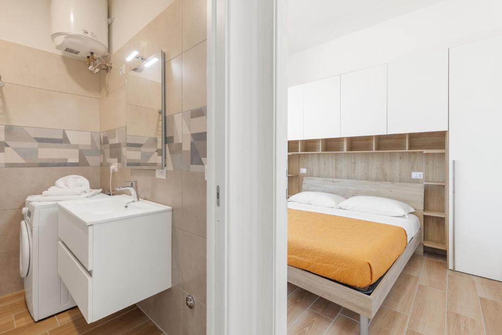Letto o letti in una camera di Residence Torvaianica