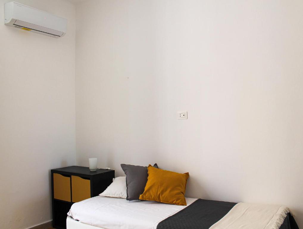 A bed or beds in a room at M&M Apartment