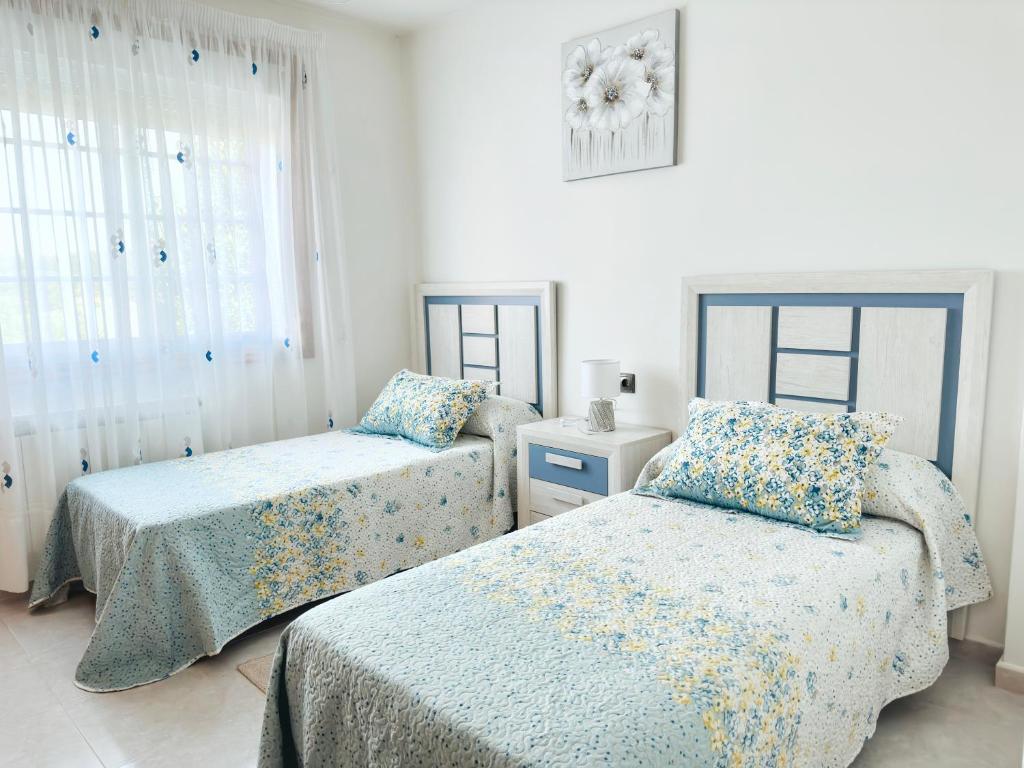 Posteľ alebo postele v izbe v ubytovaní CASA O PATELA