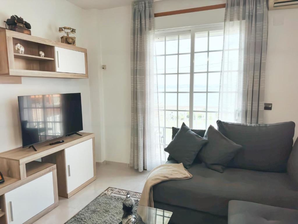 Televízia a/alebo spoločenská miestnosť v ubytovaní CASA O PATELA
