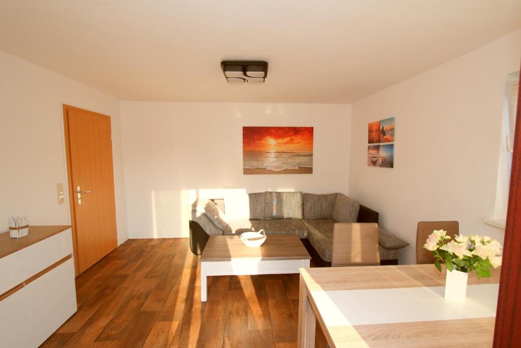 a living room with a couch and a table at Ferienwohnung Franke in Zinnowitz