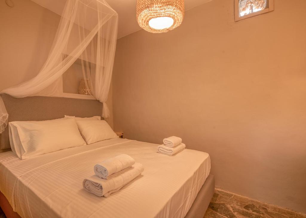 Postel nebo postele na pokoji v ubytování Mourelo Home