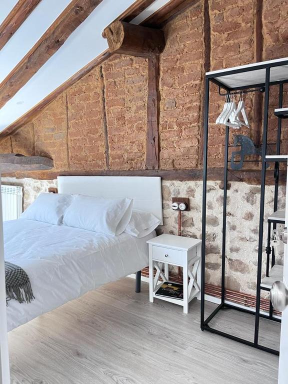 Postel nebo postele na pokoji v ubytování Apartamentos Numancia