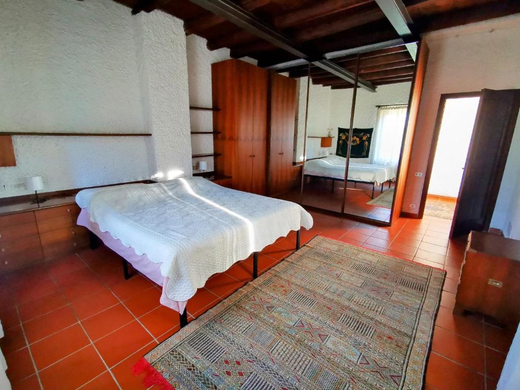 Un ou plusieurs lits dans un hébergement de l'établissement Casa Ulivi rooms