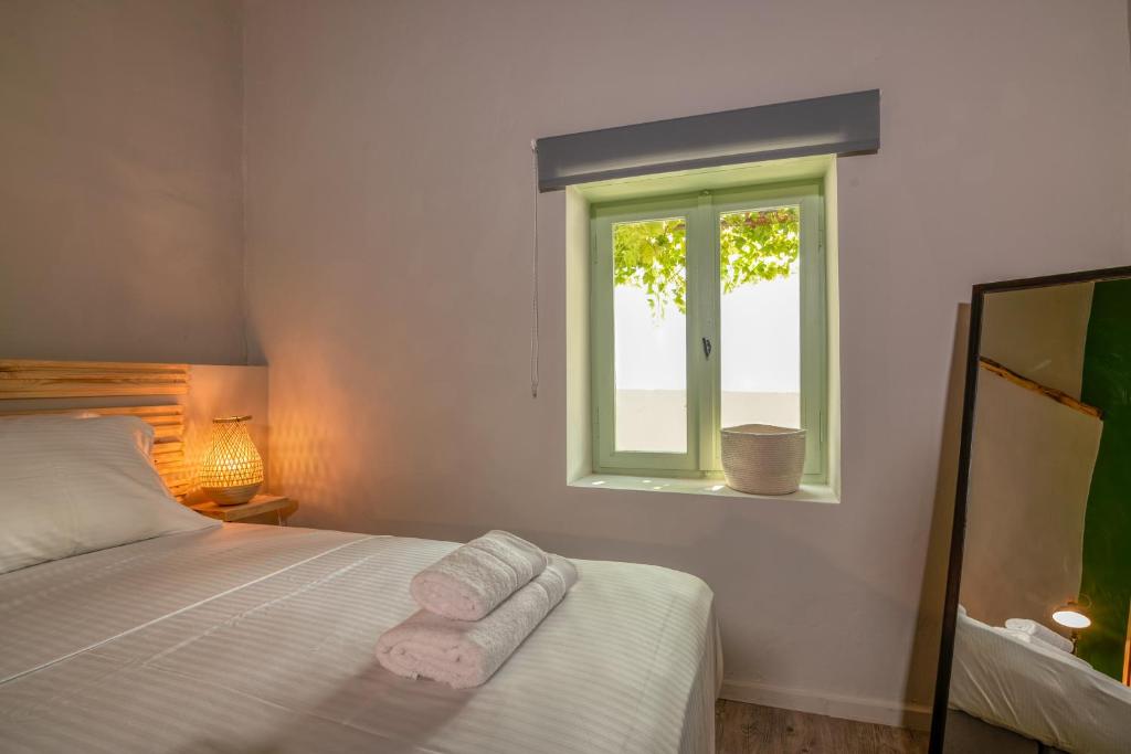 Postel nebo postele na pokoji v ubytování Mourelo Home