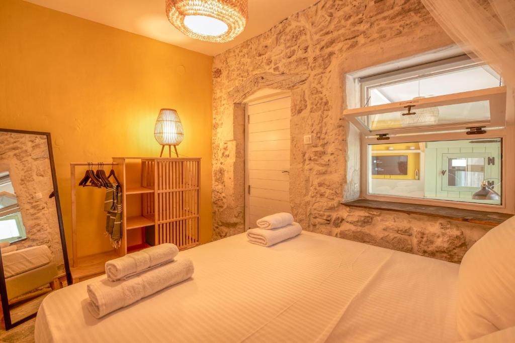 Postel nebo postele na pokoji v ubytování Mourelo Home