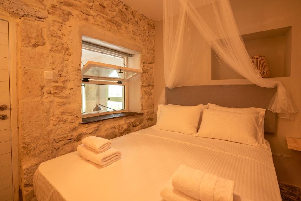 Postel nebo postele na pokoji v ubytování Mourelo Home