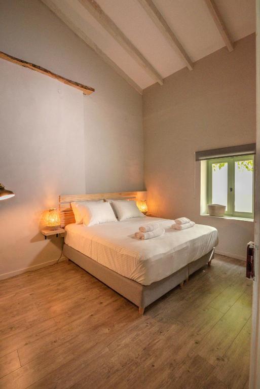 Postel nebo postele na pokoji v ubytování Mourelo Home