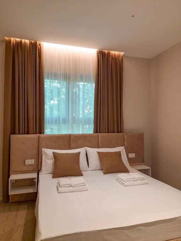 Postel nebo postele na pokoji v ubytování Solea Hotel