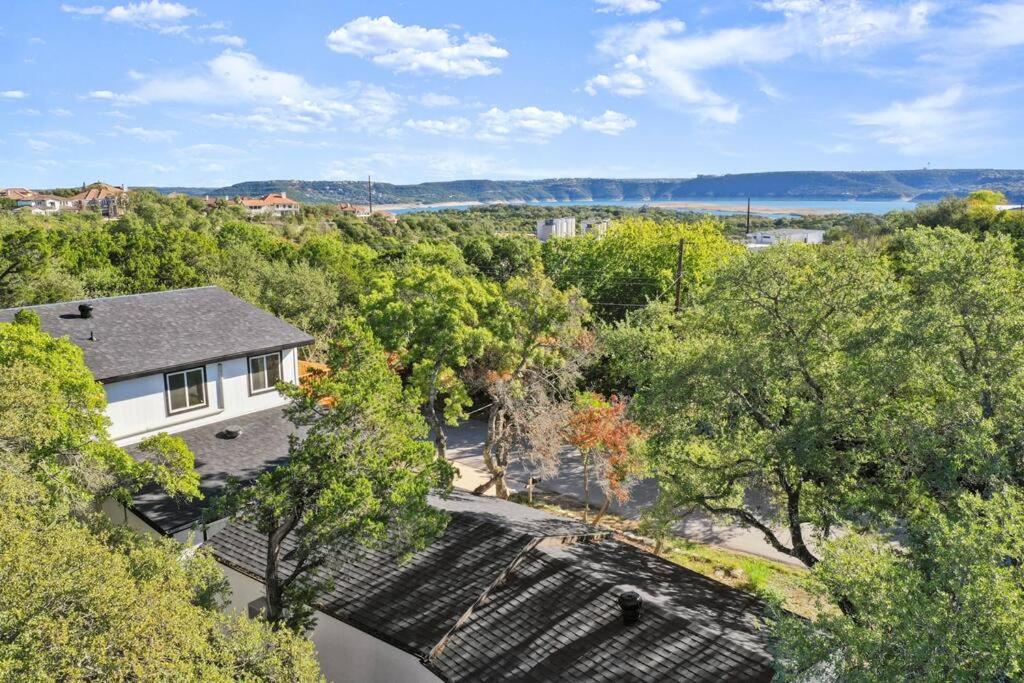 an aerial view of a house with trees at Lux Lake Travis in Austin