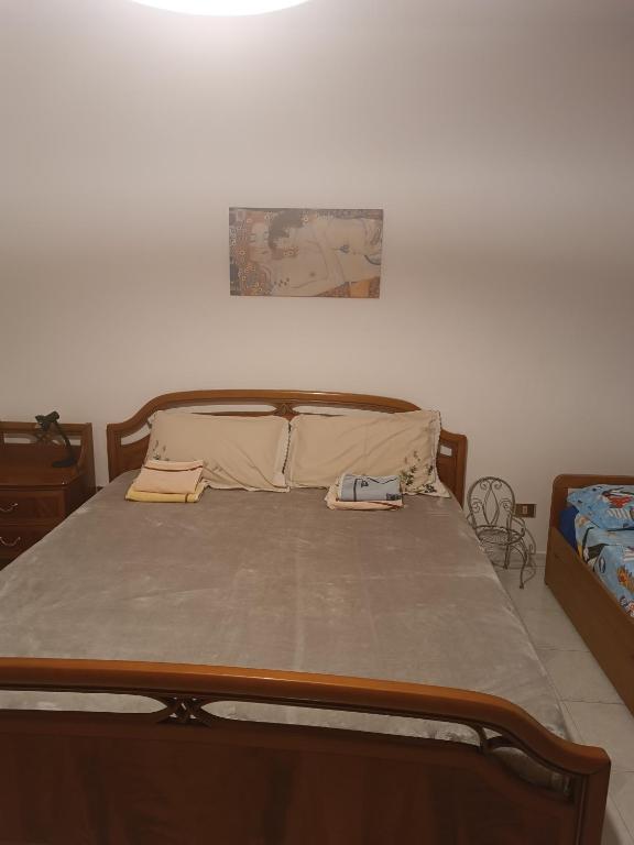Łóżko lub łóżka w pokoju w obiekcie Casa graziosa con ampio cortile per i tuoi momenti all'aperto