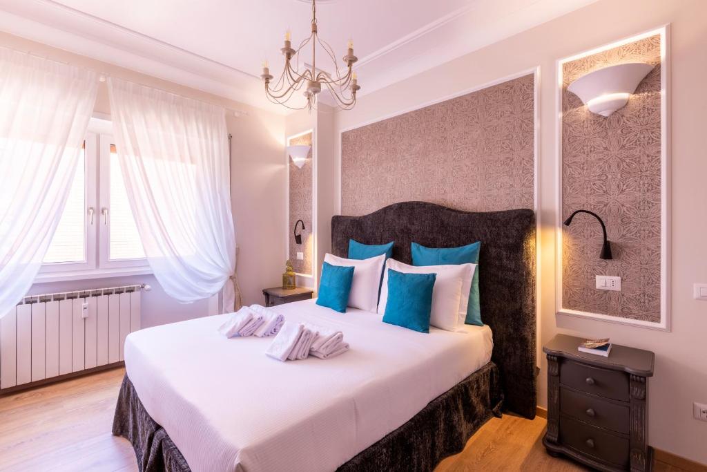 Postel nebo postele na pokoji v ubytování Trastevere Paper Suites