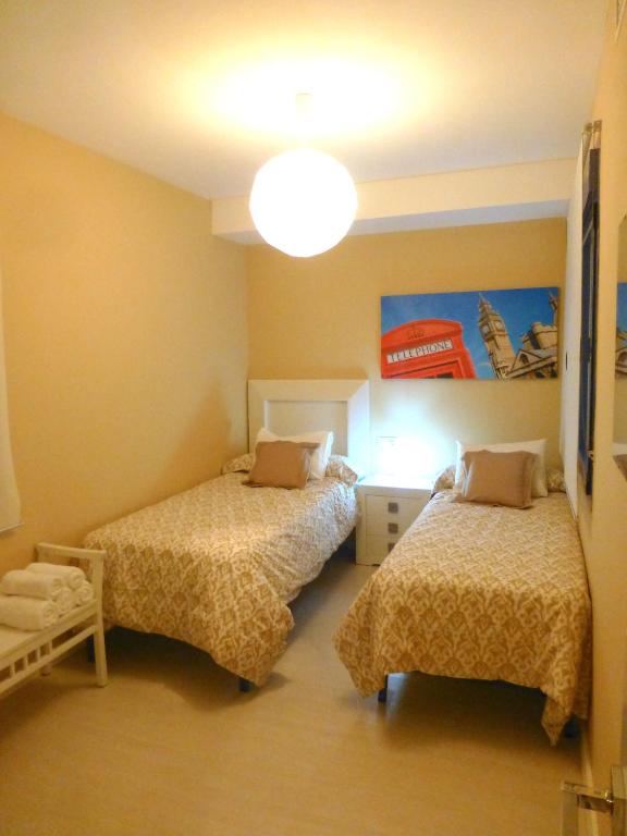 Posteľ alebo postele v izbe v ubytovaní Casa Valdevaqueros