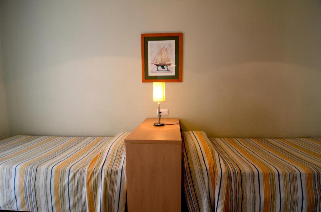 Posteľ alebo postele v izbe v ubytovaní Mestral - apartamentos céntricos