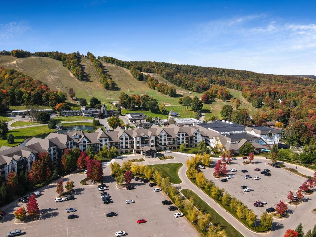 an aerial view of a resort with a parking lot at 621 Disciples Village in Boyne Falls