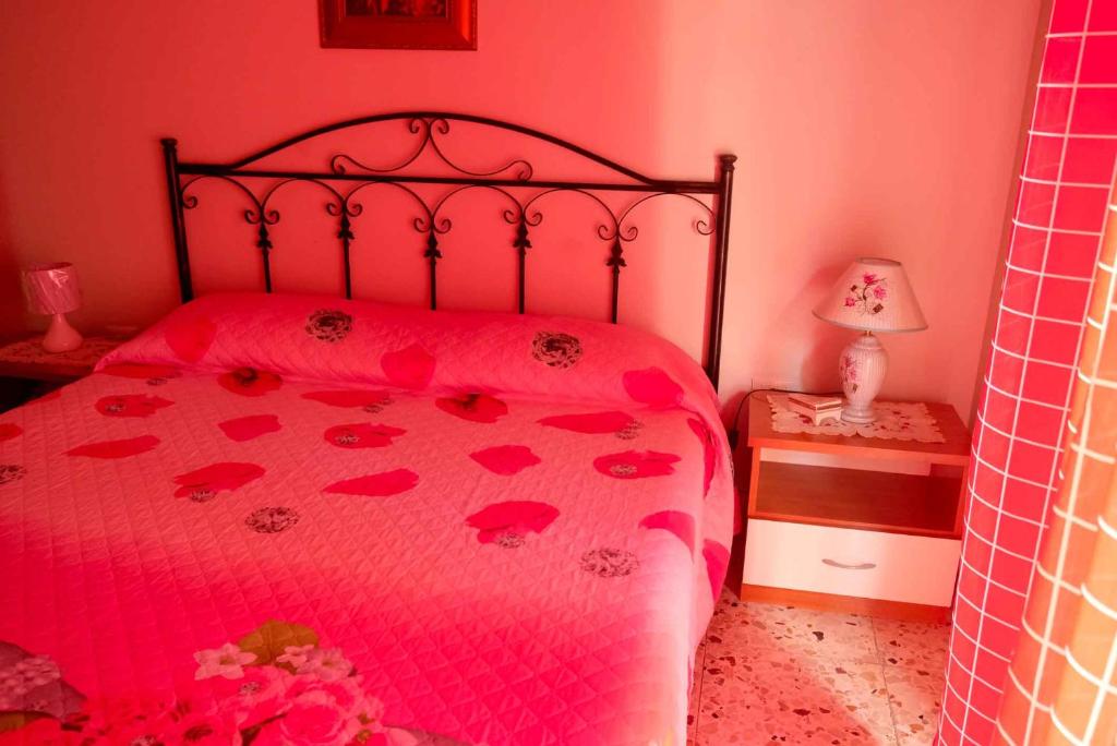 Postel nebo postele na pokoji v ubytování B&B TascaPachino