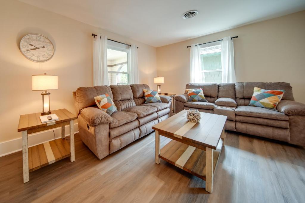 a living room with two couches and a coffee table at Ashtabula Vacation Rental with Covered Balcony in Ashtabula