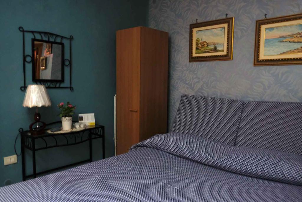 Postel nebo postele na pokoji v ubytování B&B TascaPachino