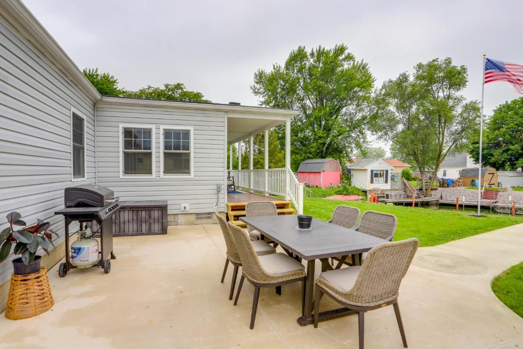 a patio with a table and chairs and a grill at Port Clinton Vacation Rental with Boat Dock and Grill! in Port Clinton