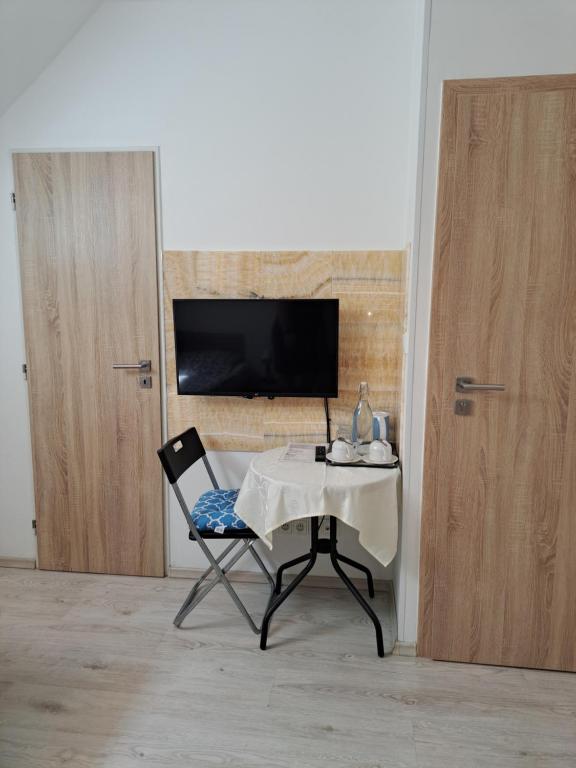 TV a/nebo společenská místnost v ubytování Apartmány Amália