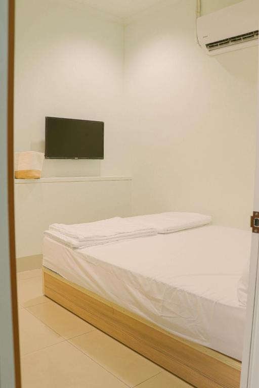 Postel nebo postele na pokoji v ubytování TETE Homestay