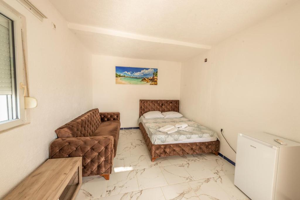 Postel nebo postele na pokoji v ubytování Apartmani Medovic