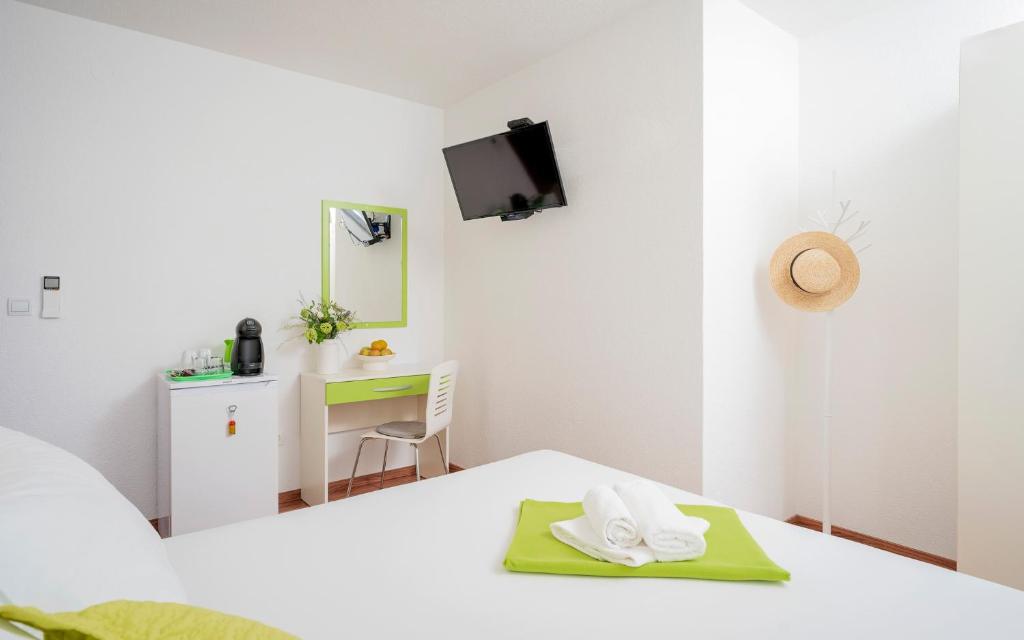 Postel nebo postele na pokoji v ubytování Guest House Milan