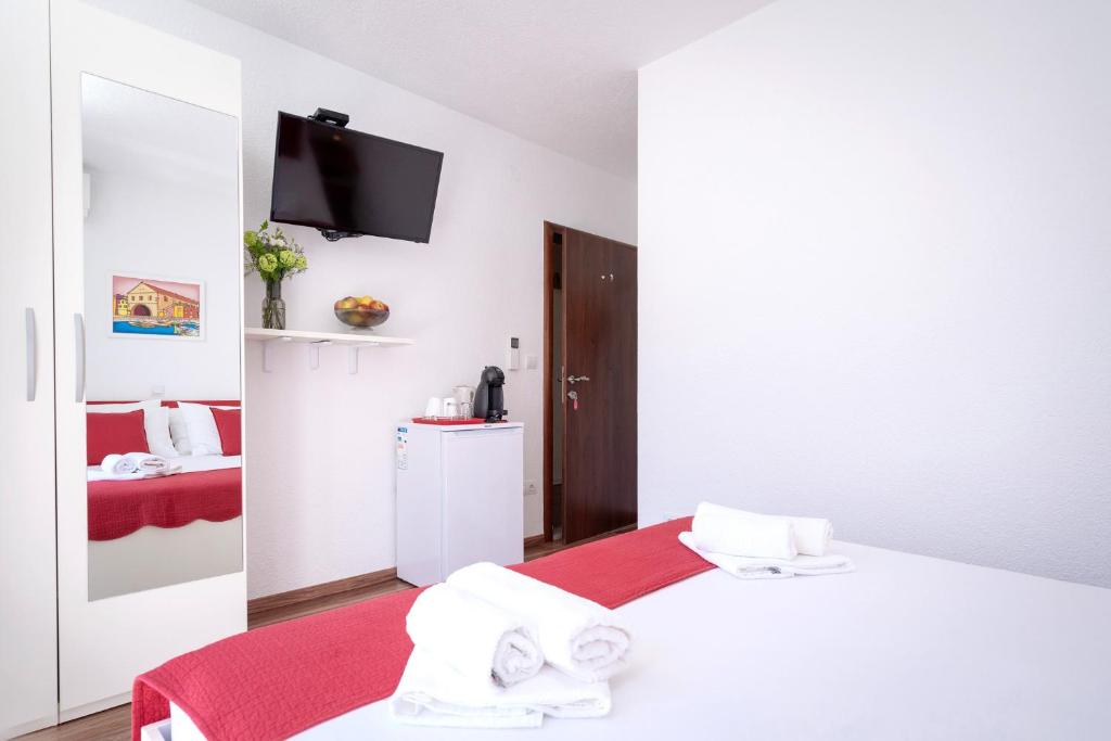 Postel nebo postele na pokoji v ubytování Guest House Milan