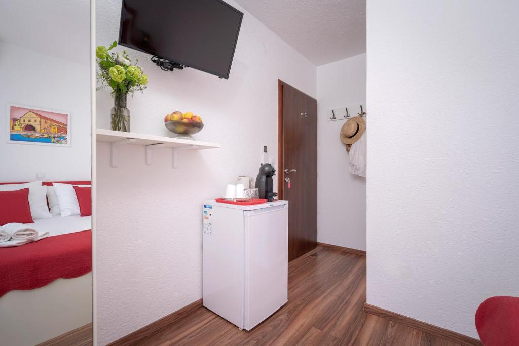 TV a/nebo společenská místnost v ubytování Guest House Milan