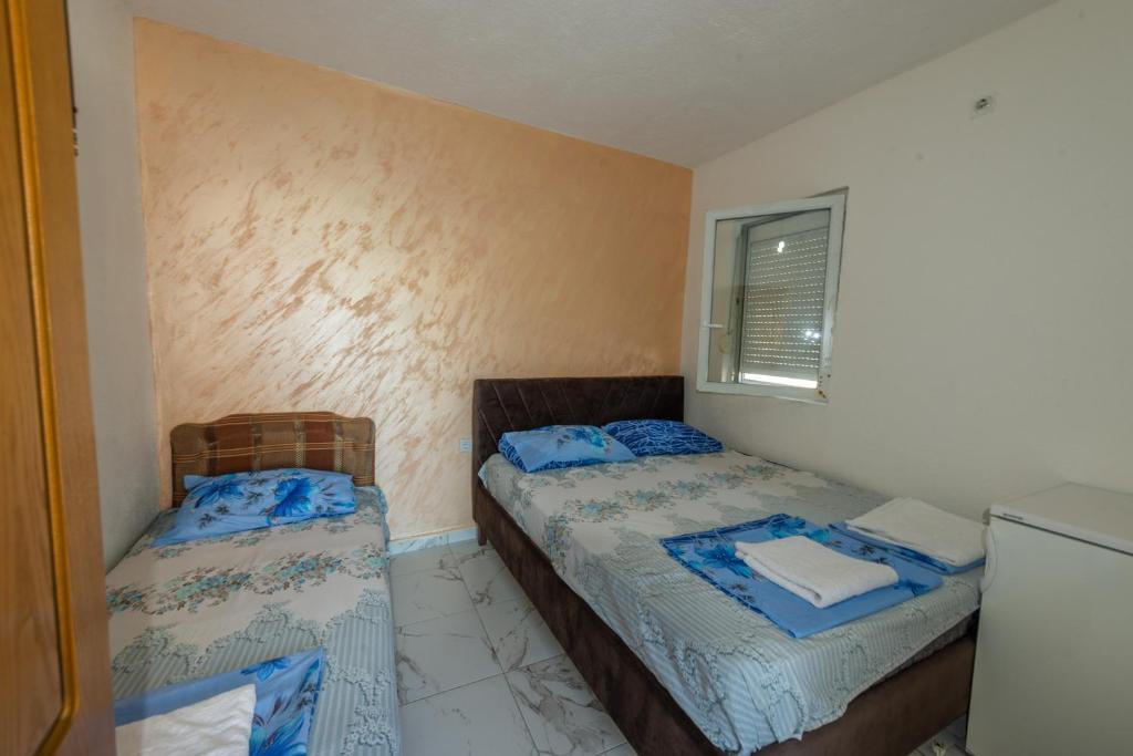 Postel nebo postele na pokoji v ubytování Apartmani Medovic