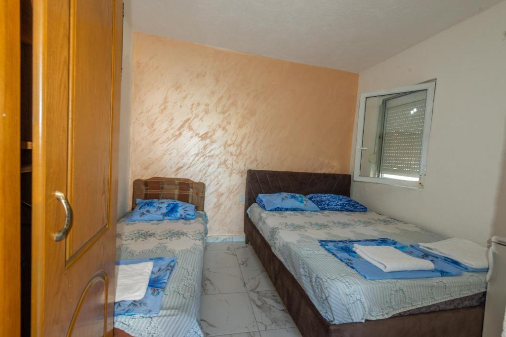 Postel nebo postele na pokoji v ubytování Apartmani Medovic