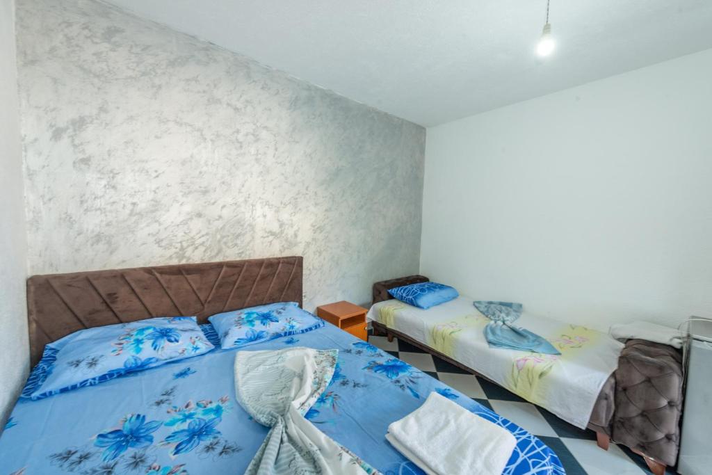 Postel nebo postele na pokoji v ubytování Apartmani Medovic