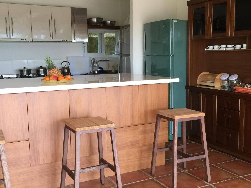 Kuchyň nebo kuchyňský kout v ubytování SunRise 23.5N B&B