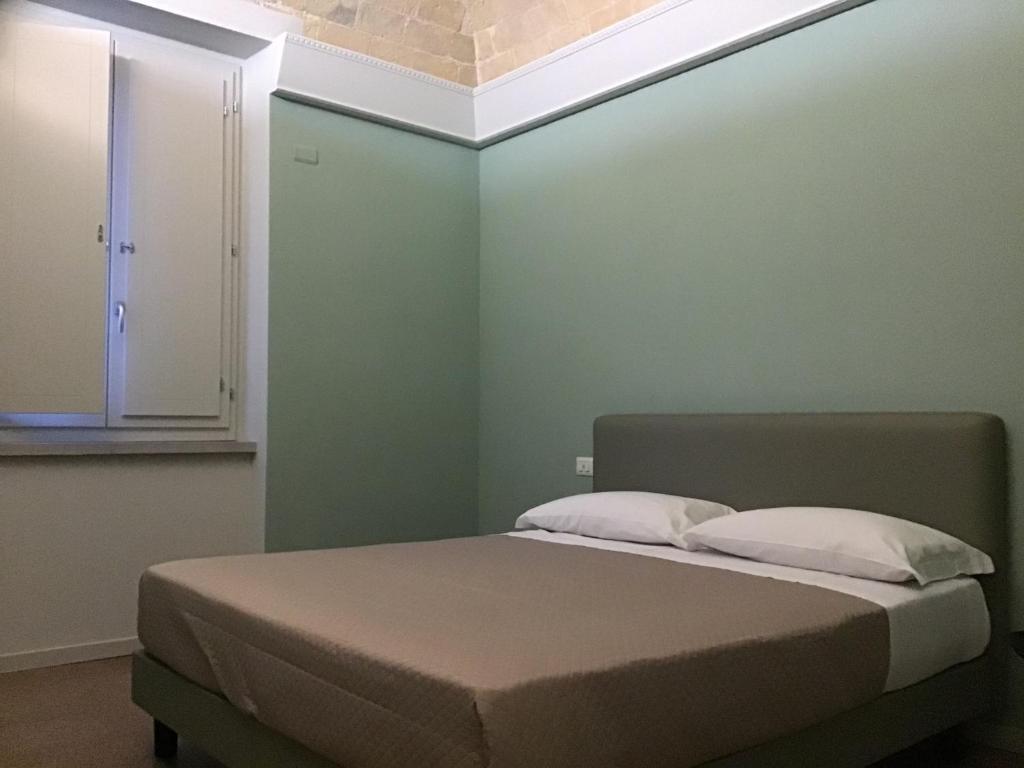 Postel nebo postele na pokoji v ubytování VILLA ACTEA