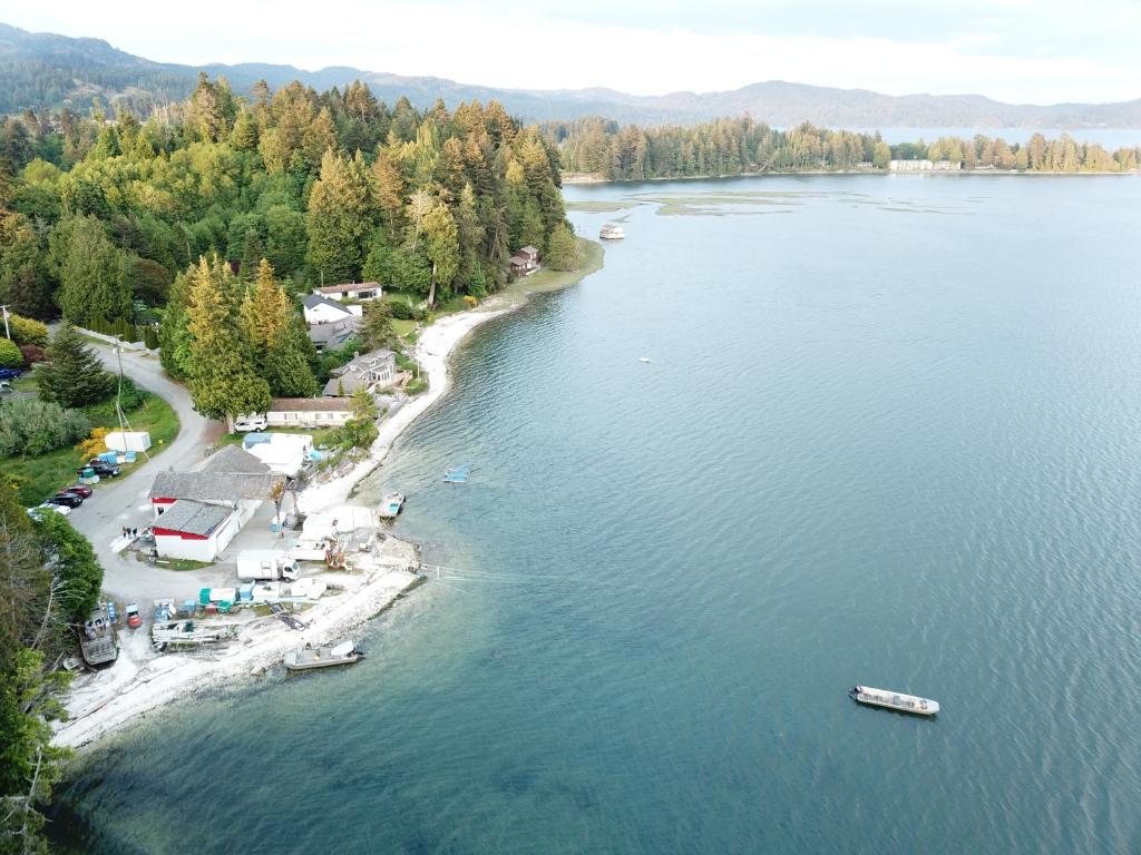 an aerial view of a lake with boats in the water at Waterfront Paradise in Sooke