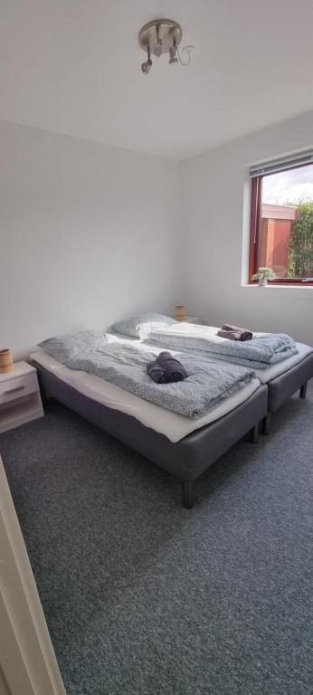 Postel nebo postele na pokoji v ubytování Family-friendly house close to Aarhus
