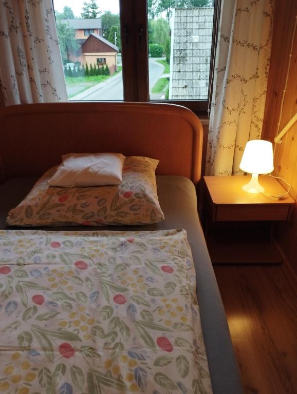 Posteľ alebo postele v izbe v ubytovaní Pod limbą