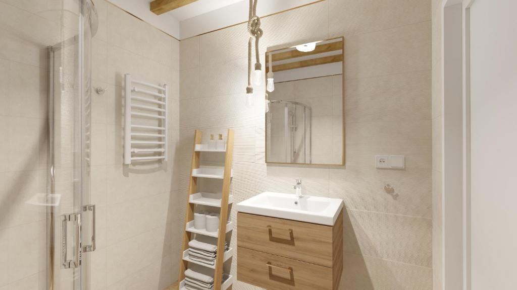 a white bathroom with a sink and a mirror at Apartamenty Na Fali in Jastarnia
