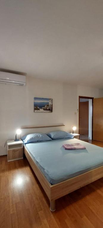 Postel nebo postele na pokoji v ubytování Apartments Zoran