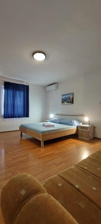 Postel nebo postele na pokoji v ubytování Apartments Zoran