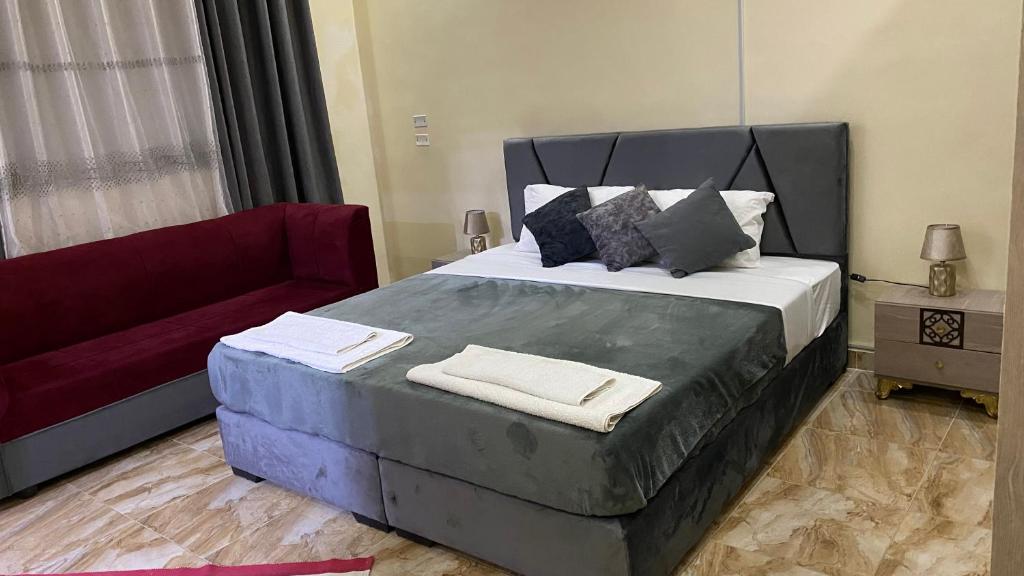 Postel nebo postele na pokoji v ubytování Petra Rose Apartment
