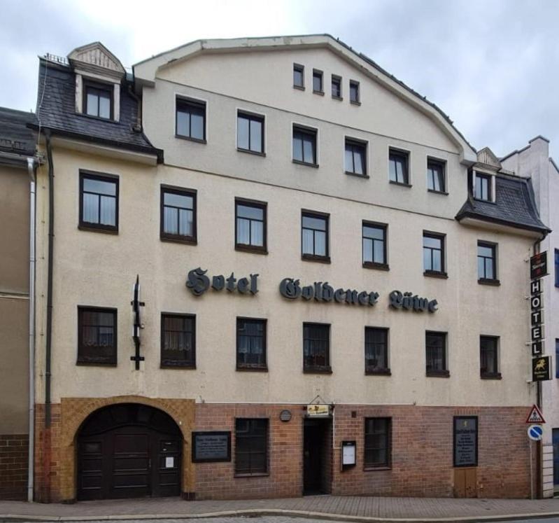 a building with the words old gathering centre on it at Traditionshotel Goldener Löwe in Zeulenroda