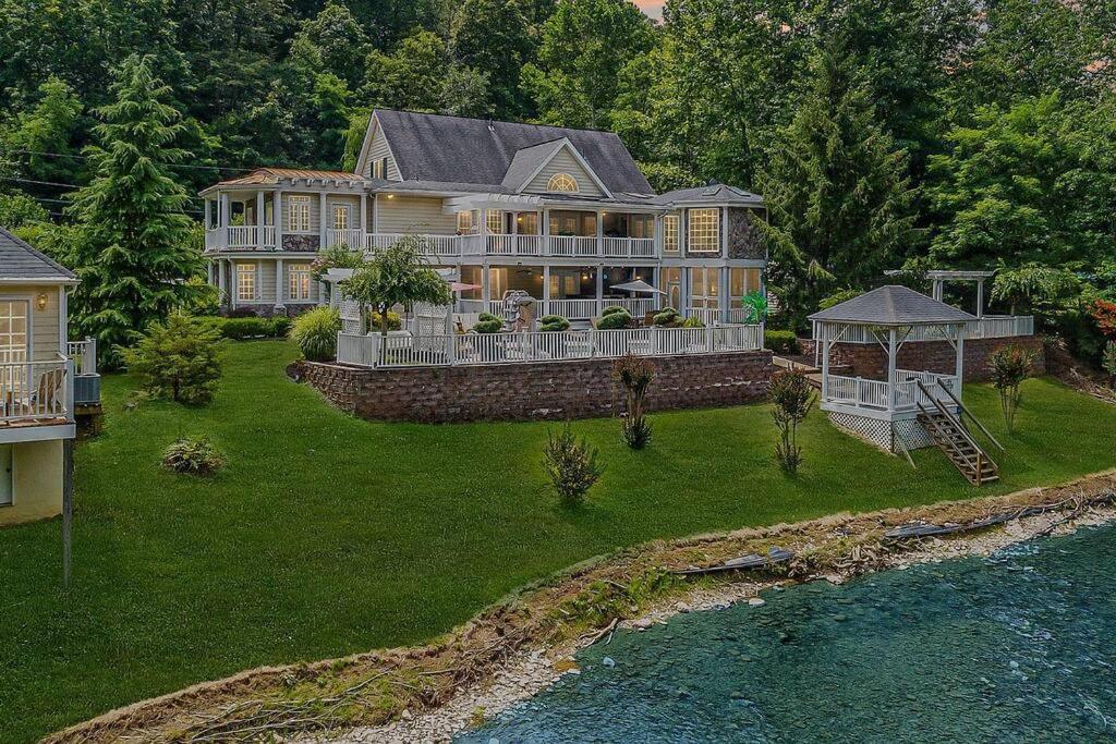 an aerial view of a large house at Jackson River Estate Main House Pool, Riverfront, sleeps 15 in Covington